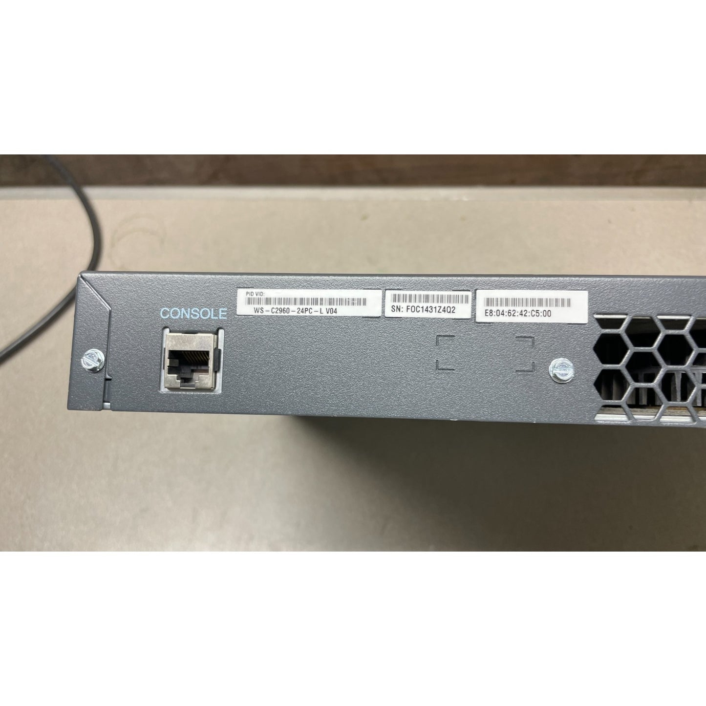 Cisco Catalyst 2960 Series PoE-24 back panel closeup of console connection
