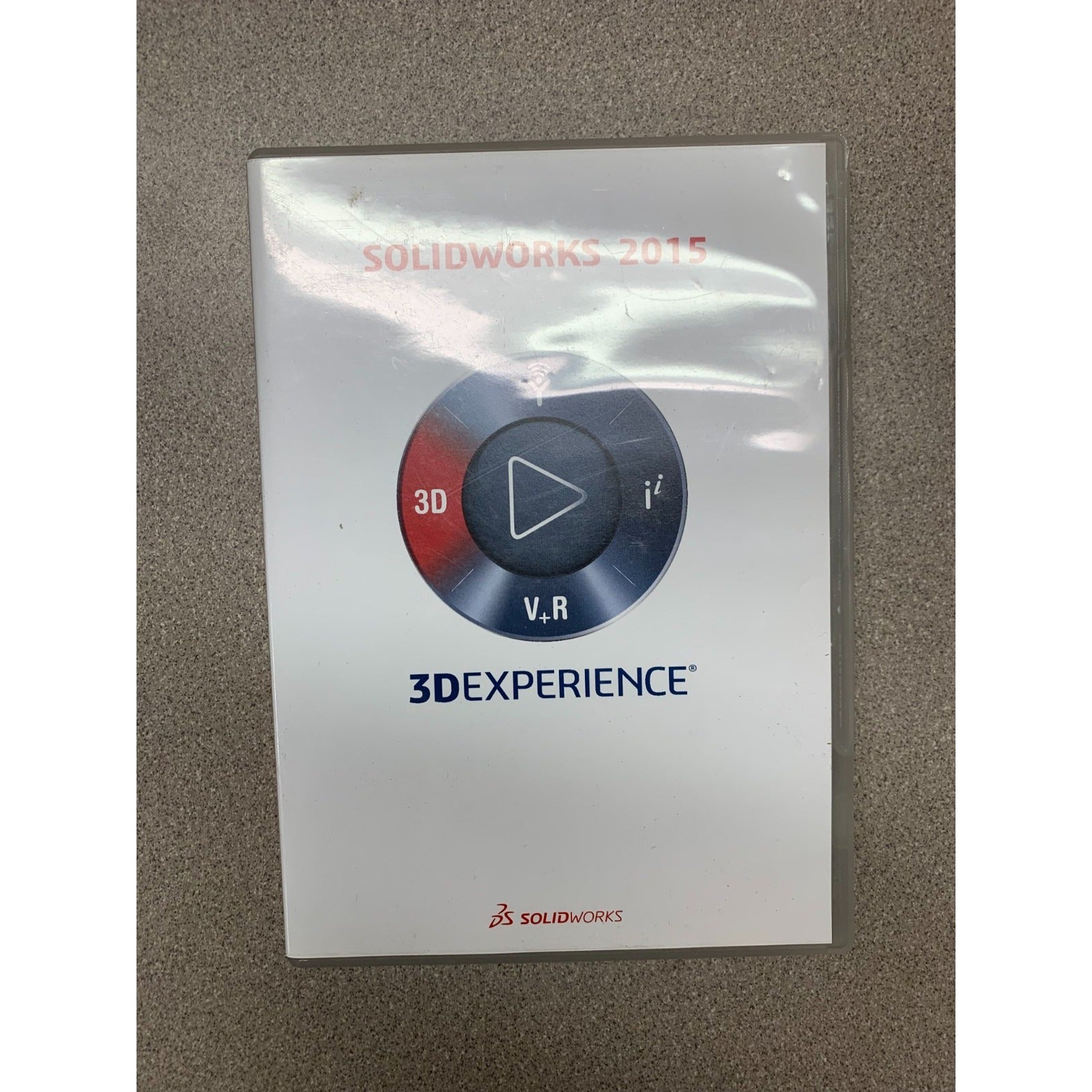 SolidWorks 2015 3DExperience software package on a gray surface