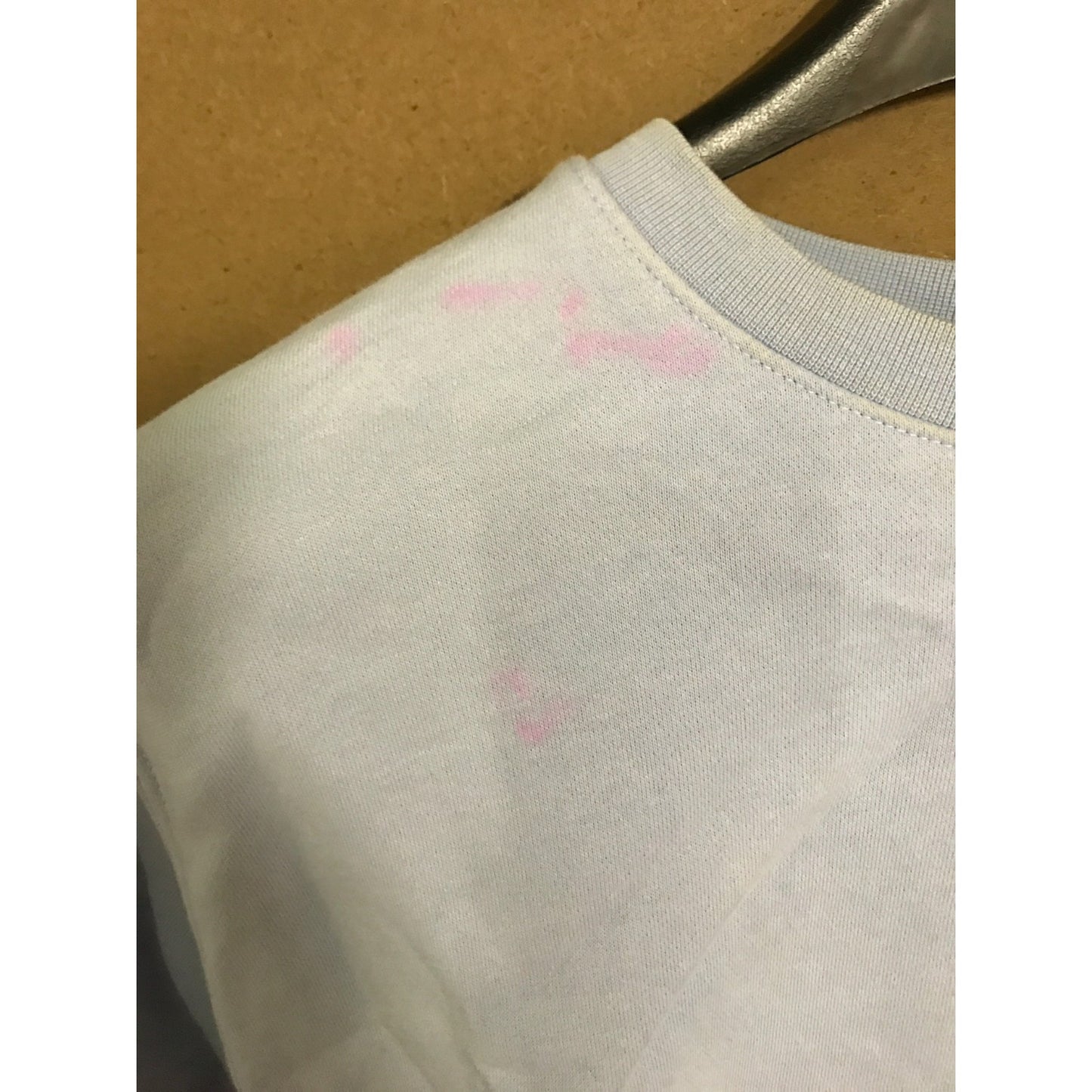 Nike Crewneck Pullover Sweatshirt Lilac Women's Medium closeup of pink stain