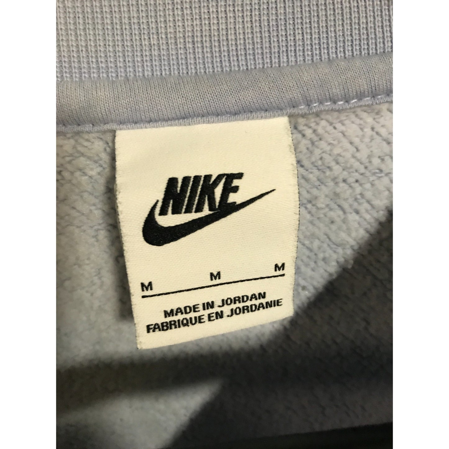 Nike label on a gray fabric background