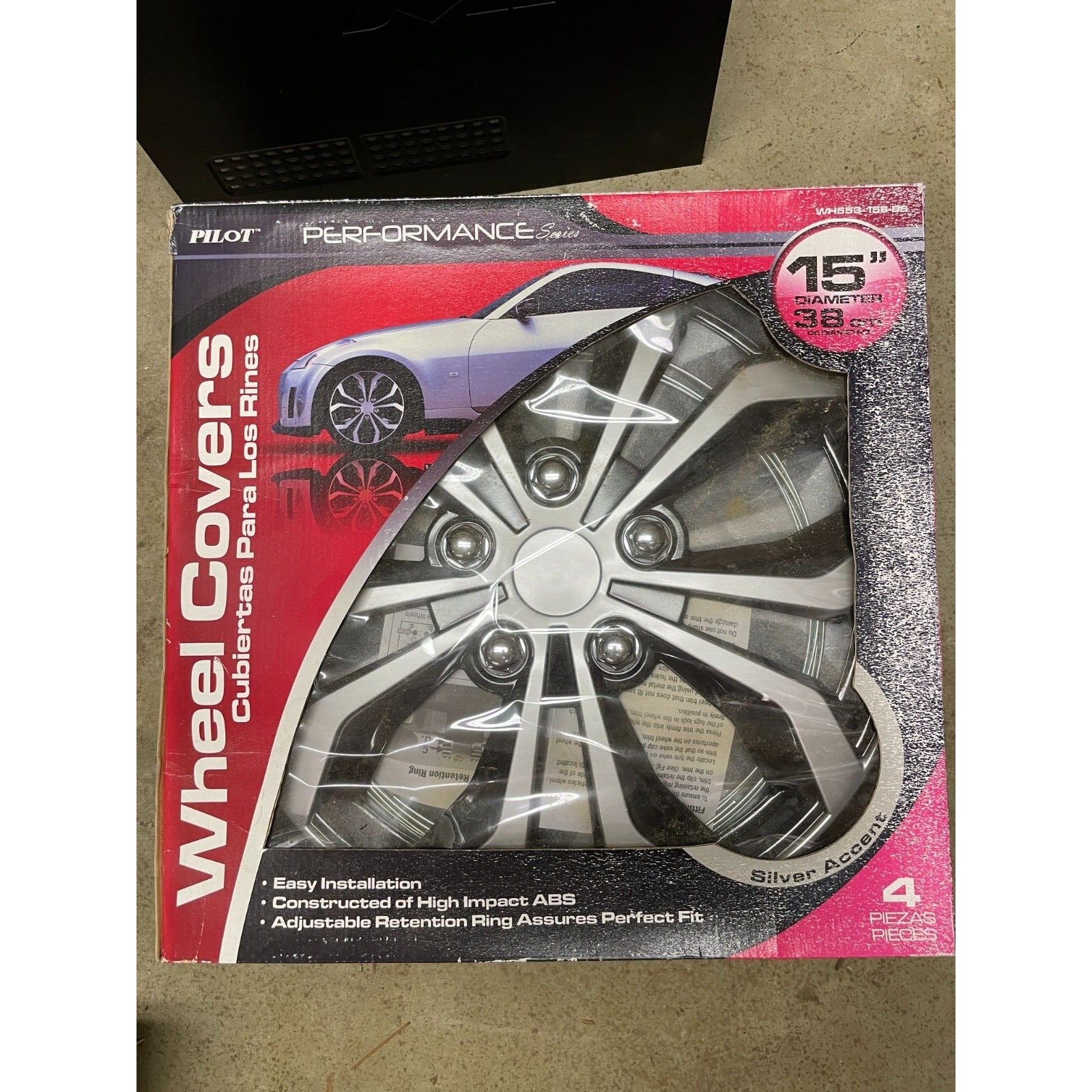 Pilot Performance Series 15 in diameter Wheel Covers lot of 4 WH553-15S-BS front of package displaying wheel covers and package content