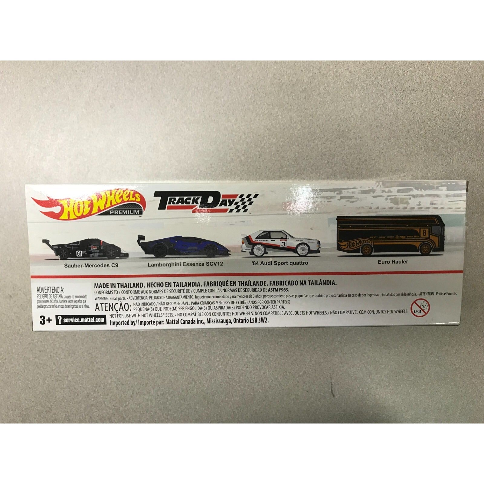 Mattel Hot Wheels Premium HW Track Day Set Euro Hauler back of package displays content