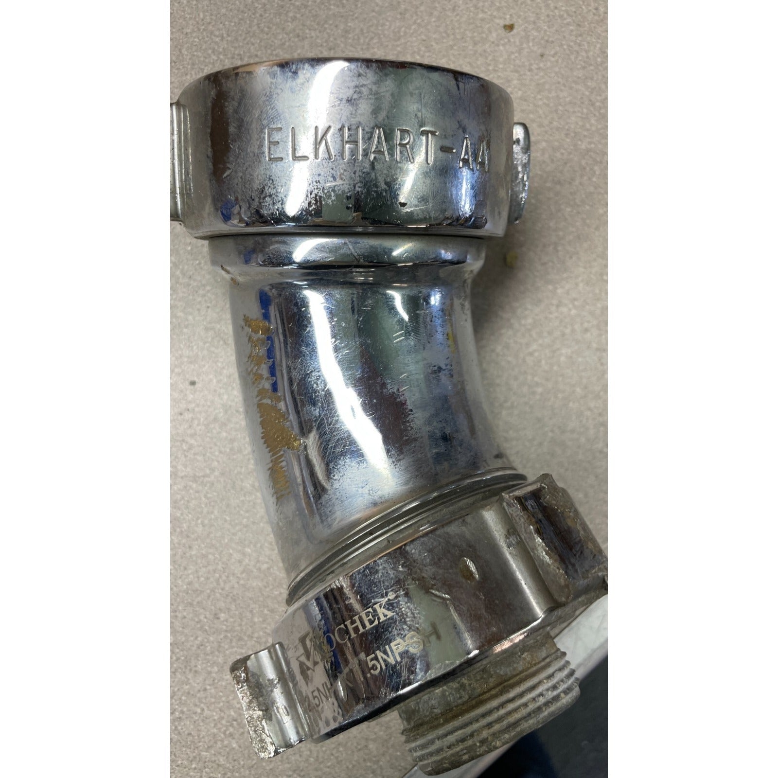 Kochek 5NHX 1.5NPSH elbow side view with manufacturer's stamp closeup