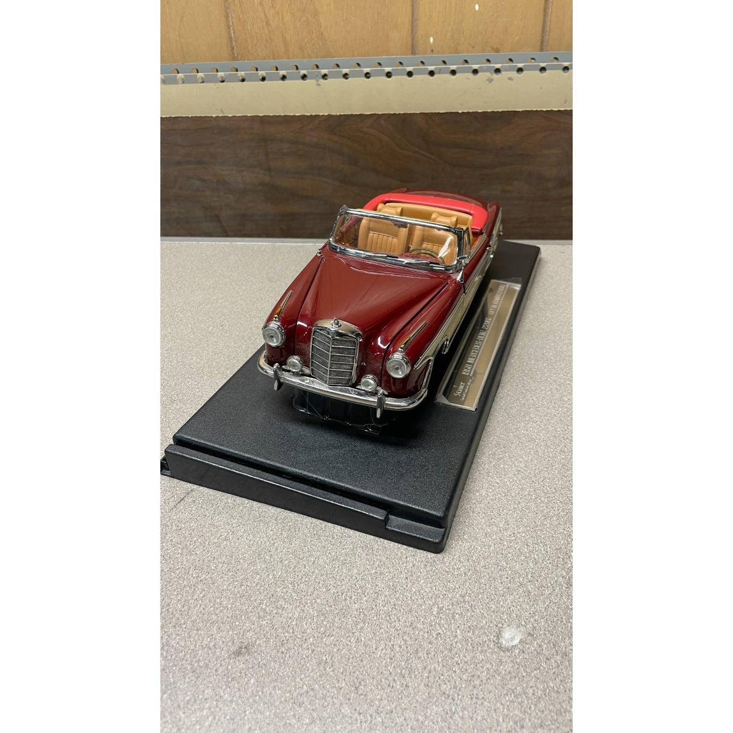 Stauer 1958 Mercedes-Benz 220SE Open Convertible Die Cast, Scale: 1/18 front end view on display platform