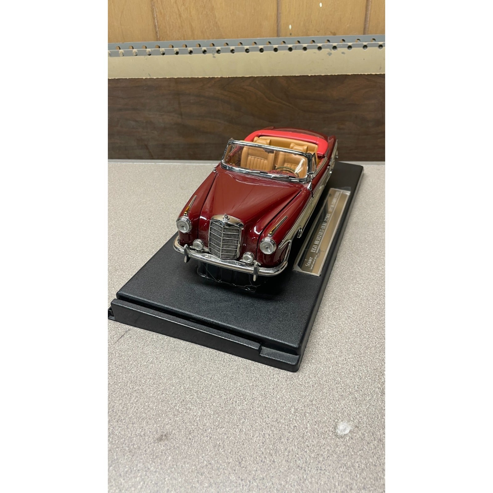 Stauer 1958 Mercedes-Benz 220SE Open Convertible Die Cast, Scale: 1/18 front end view on display platform