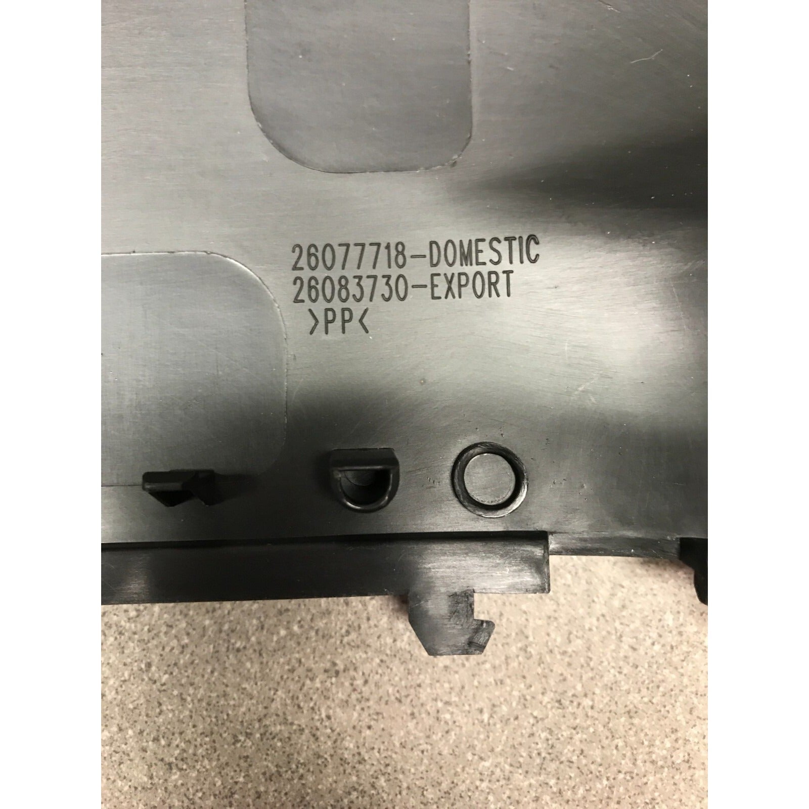 GM Ebony Steering Column Trim Cover 26077718 26081158 closeup of part number