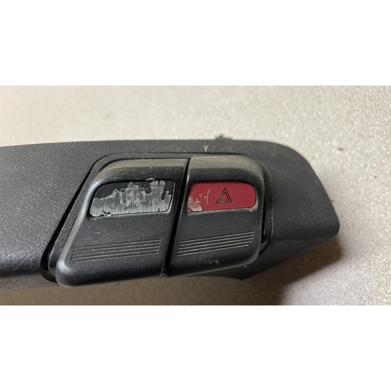 OEM Honda Civic Del Sol Dash Trim Strip AUX Light Hazard and Defrost Switches closeup of defrost and hazard buttons