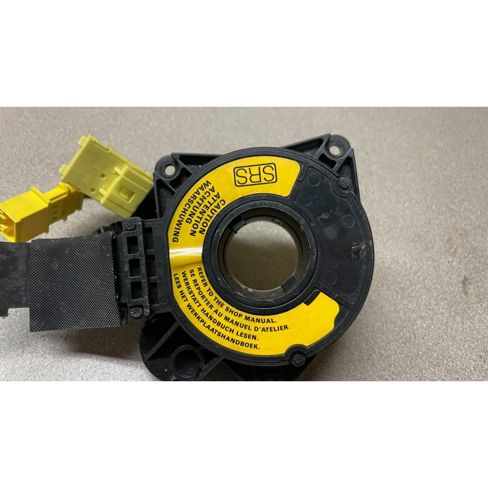 OEM Honda Civic Del Sol Clock Spring closeup with caution label