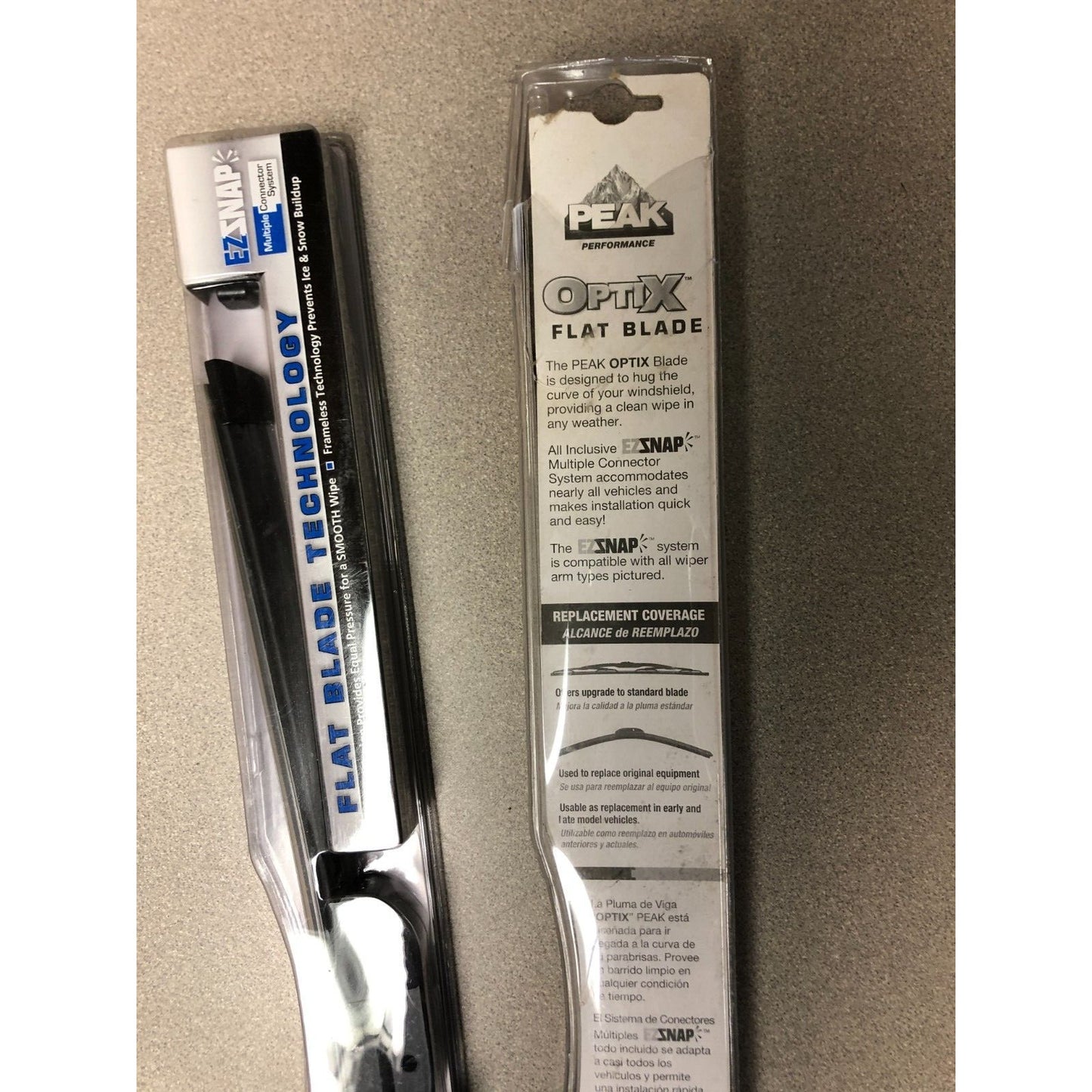 Peak Optix flat blade with packaging on a beige background