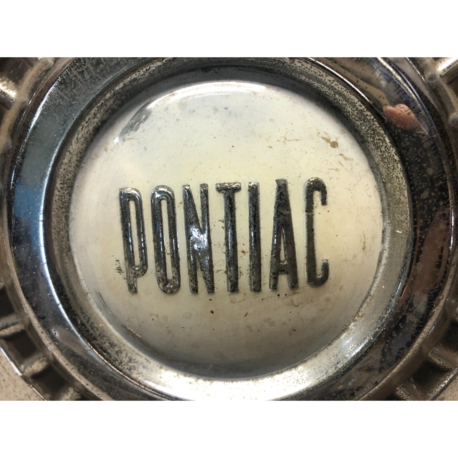 1966 Pontiac Chrome OEM Wheel Center Cap center close up some scratches