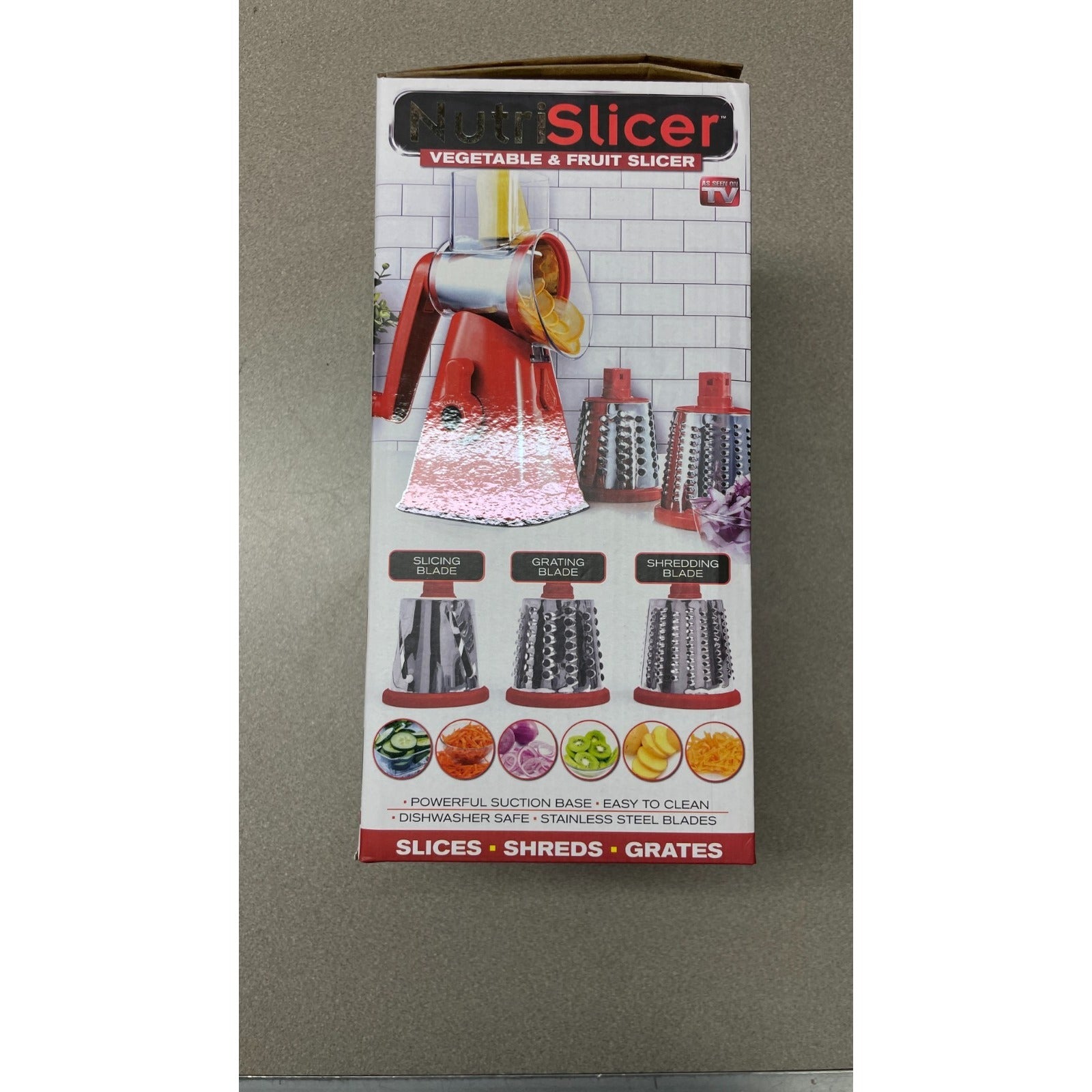 Box of a vegetable and fruit slicer with images of the product on a gray background