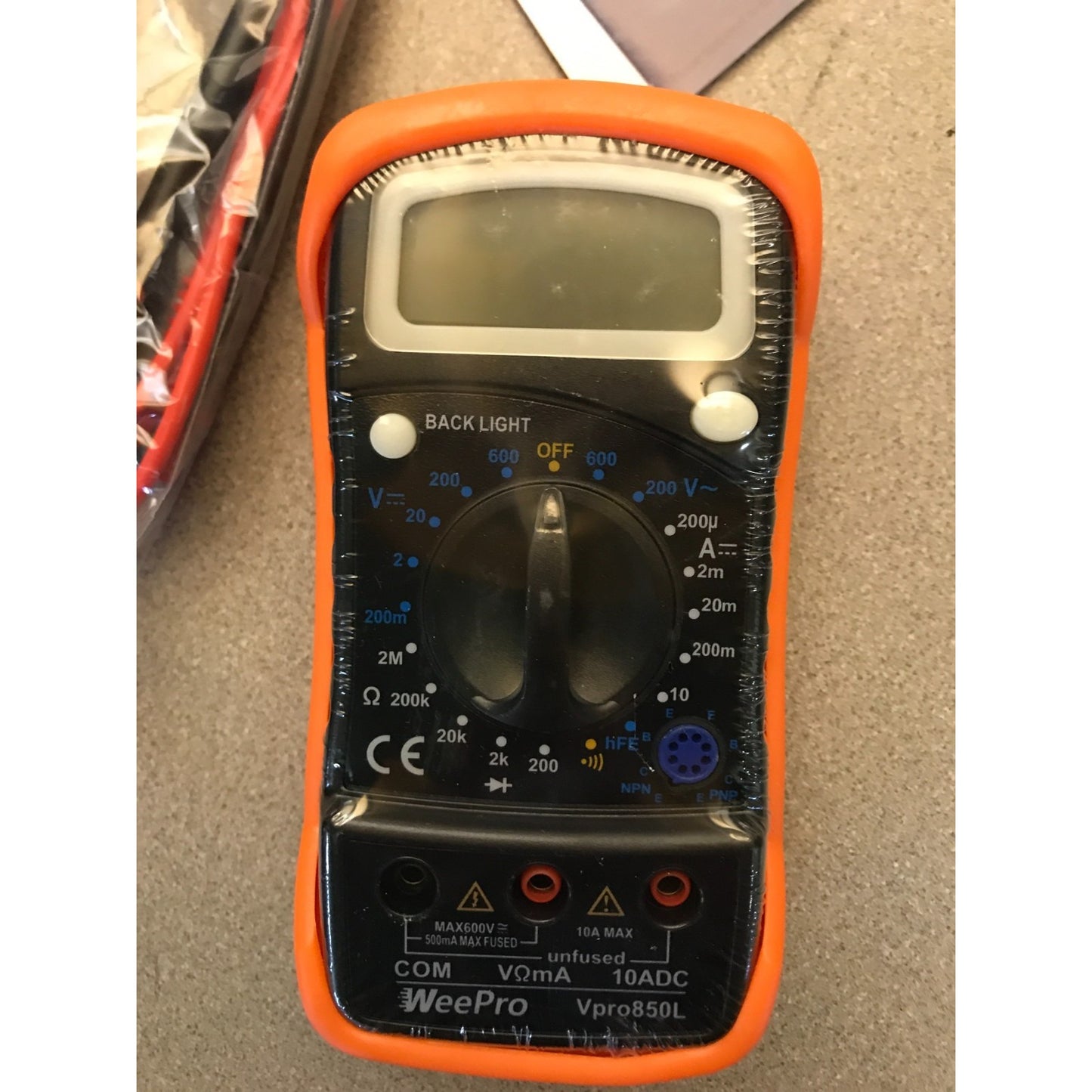 WeePro Vpro850L Multimeter AC/DC Voltage and Current Reader closeup of front of multimeter sealed in plastic