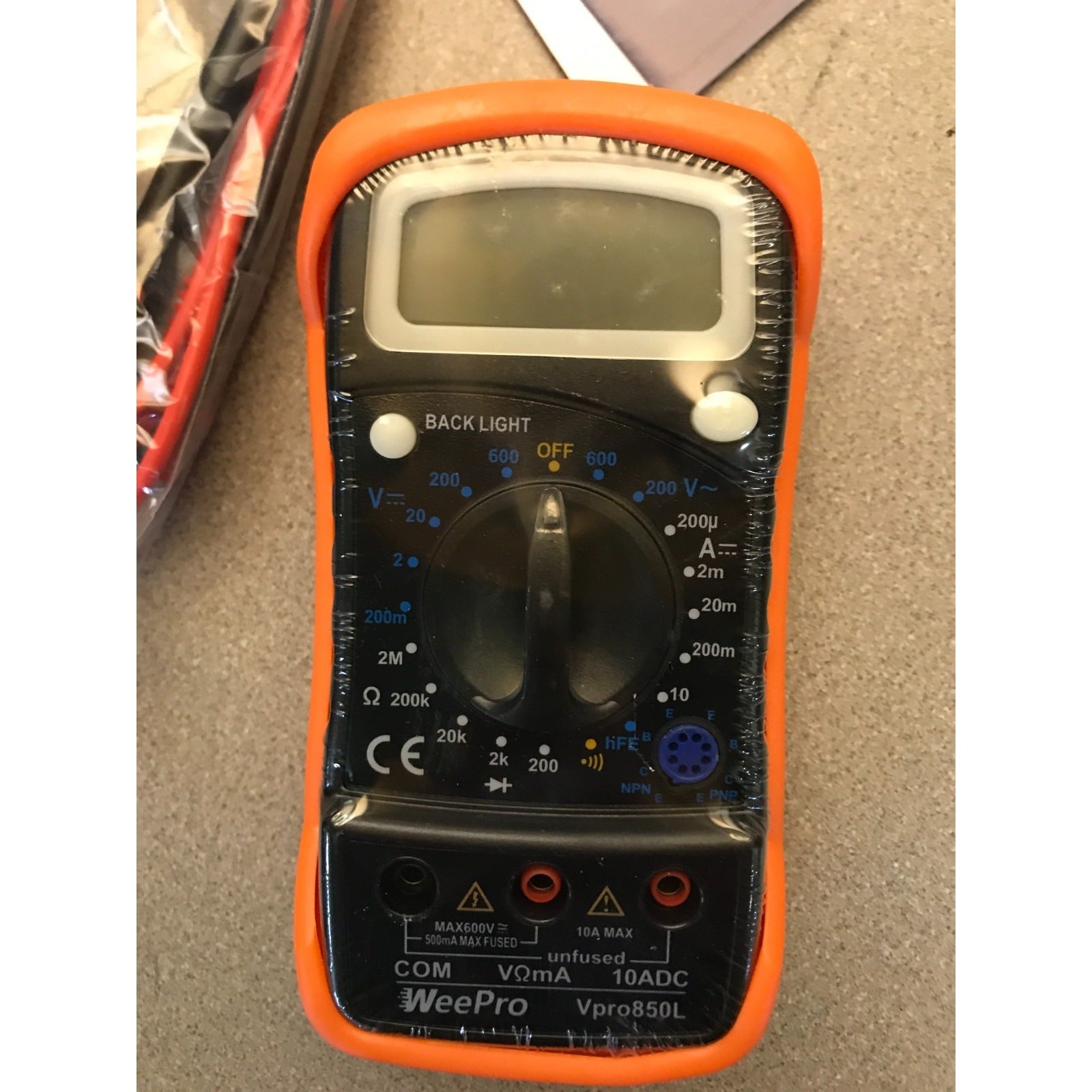WeePro Vpro850L Multimeter AC/DC Voltage and Current Reader closeup of front of multimeter sealed in plastic