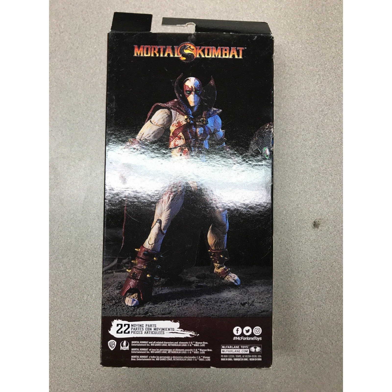 Mortal Kombat Street Fighter action figure box, featuring the character Guile on the front packaging, photographed on a neutral gray surface.