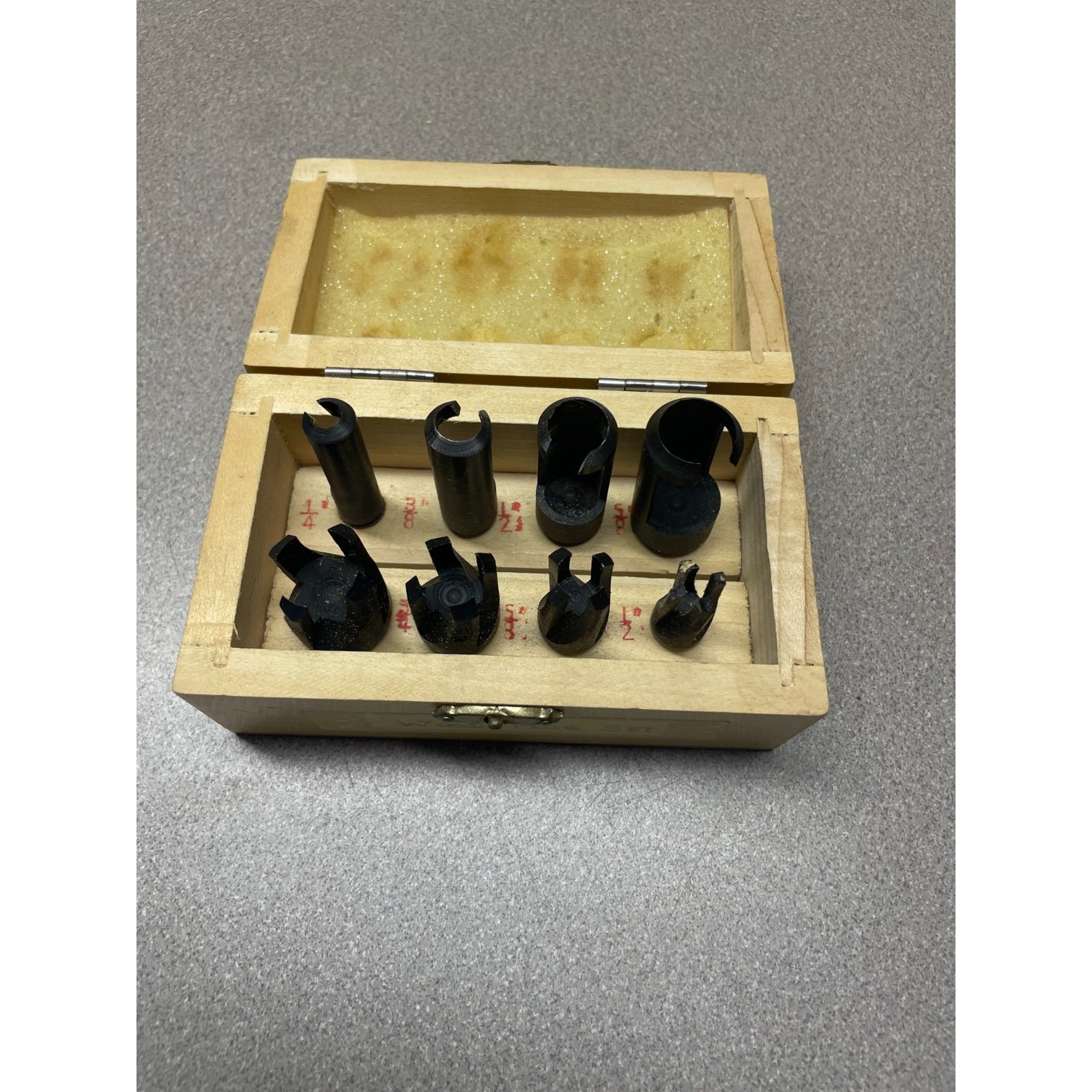 8 Piece Wood Plug Cutter Set 1/4" - 1/2" In Wooden Case top view of cutters in wooden case