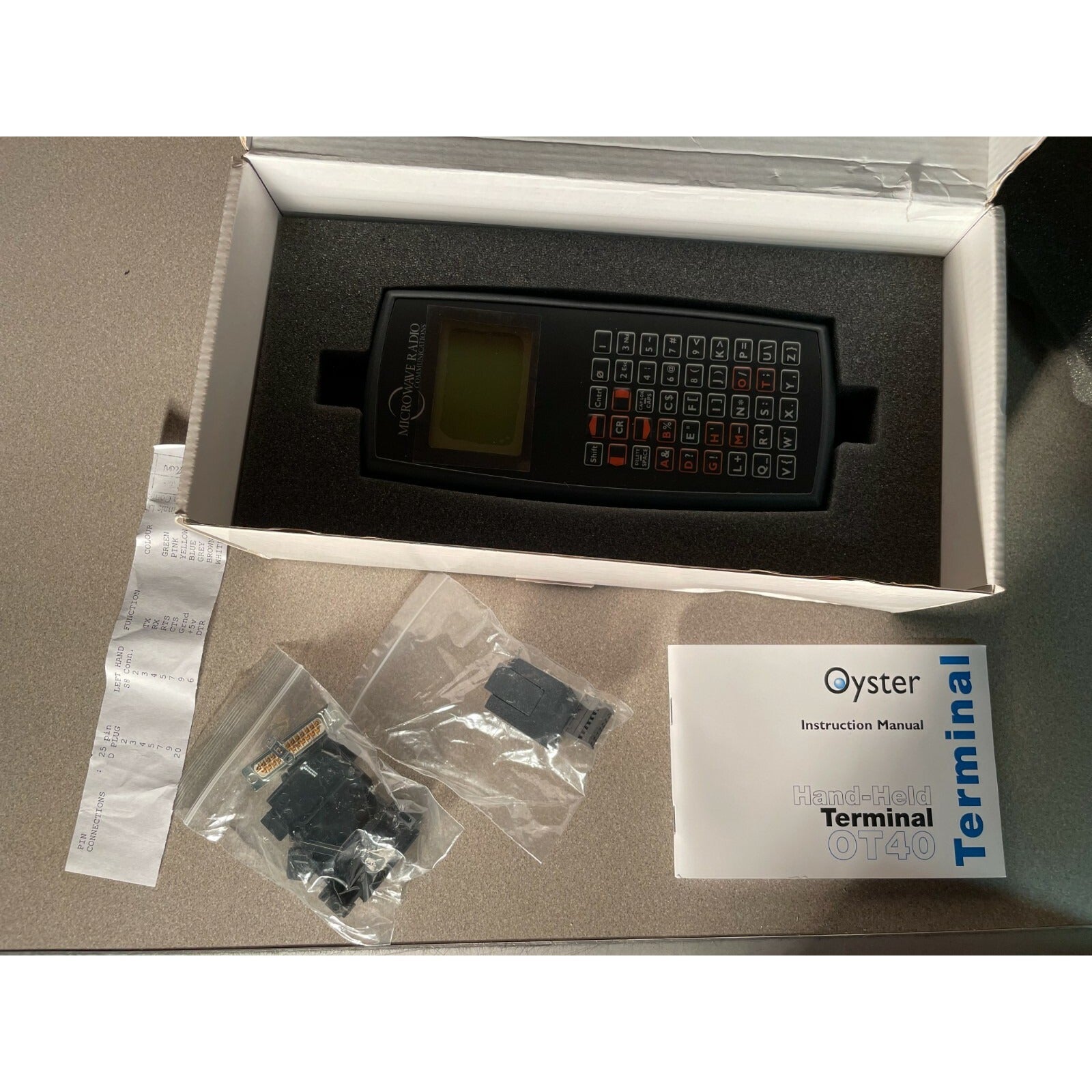 Oyster Hand-Held Terminal OT40 unit in box with accessories and manual