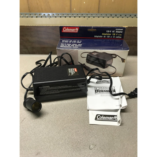 Coleman 120-V AC Adaptor, Converts to 12 Volts DC (5.25 amps), 5232E640T adaptor and user manual in front of box