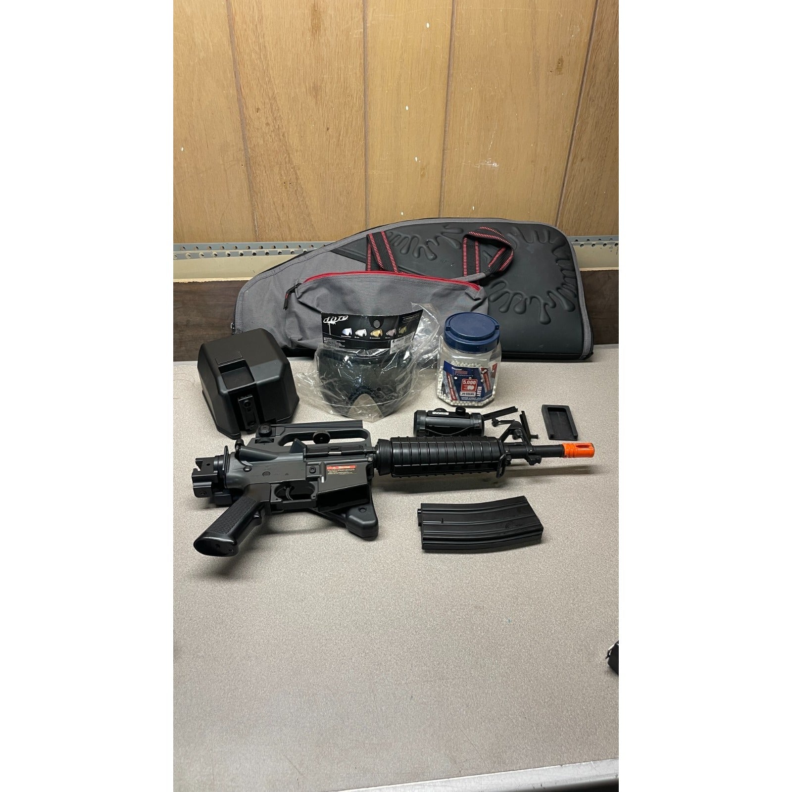 DPMS Panther Arms U050810381 M4 Style Airsoft Gun Lot UNTESTED, Accessories and Bag Included. Swiss Arms Sight, DYE i4 Goggle Lens, Crosman .20 Grams Airsoft items included