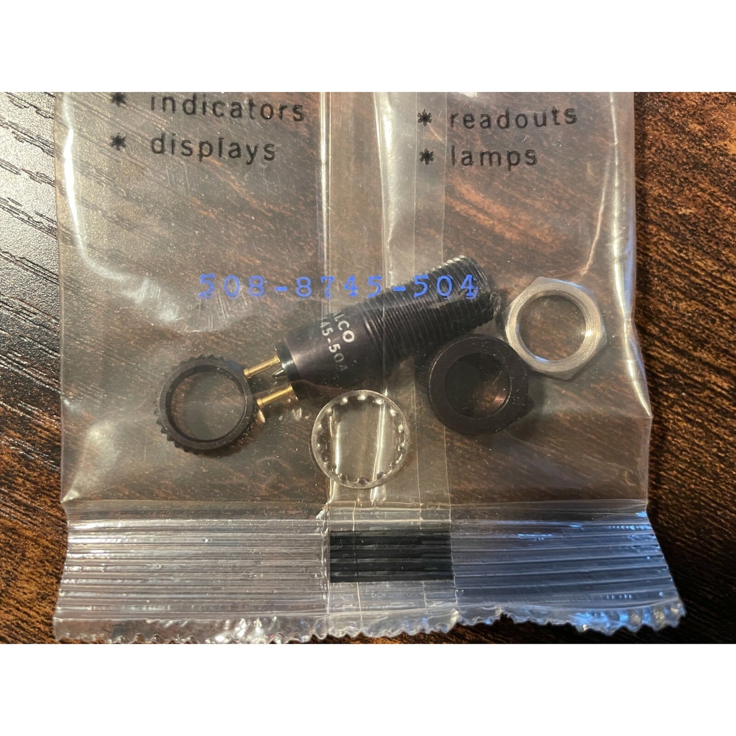 Dialight 508-8745-504 Dialco 75W 125V Lamp Socket Holder full view of socket in clear plastic bag
 
