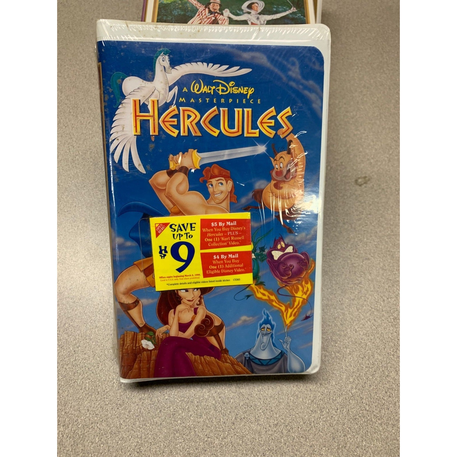 VHS tape of 'Hercules' with promotional label on a beige background