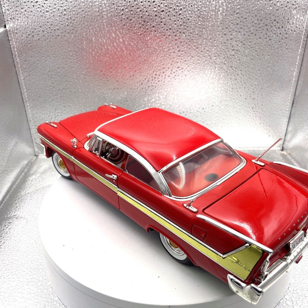 Motor Max 1958 Plymouth Fury Red Die Cast, Scale 1:18, No. 73115 drivers side and trunk view