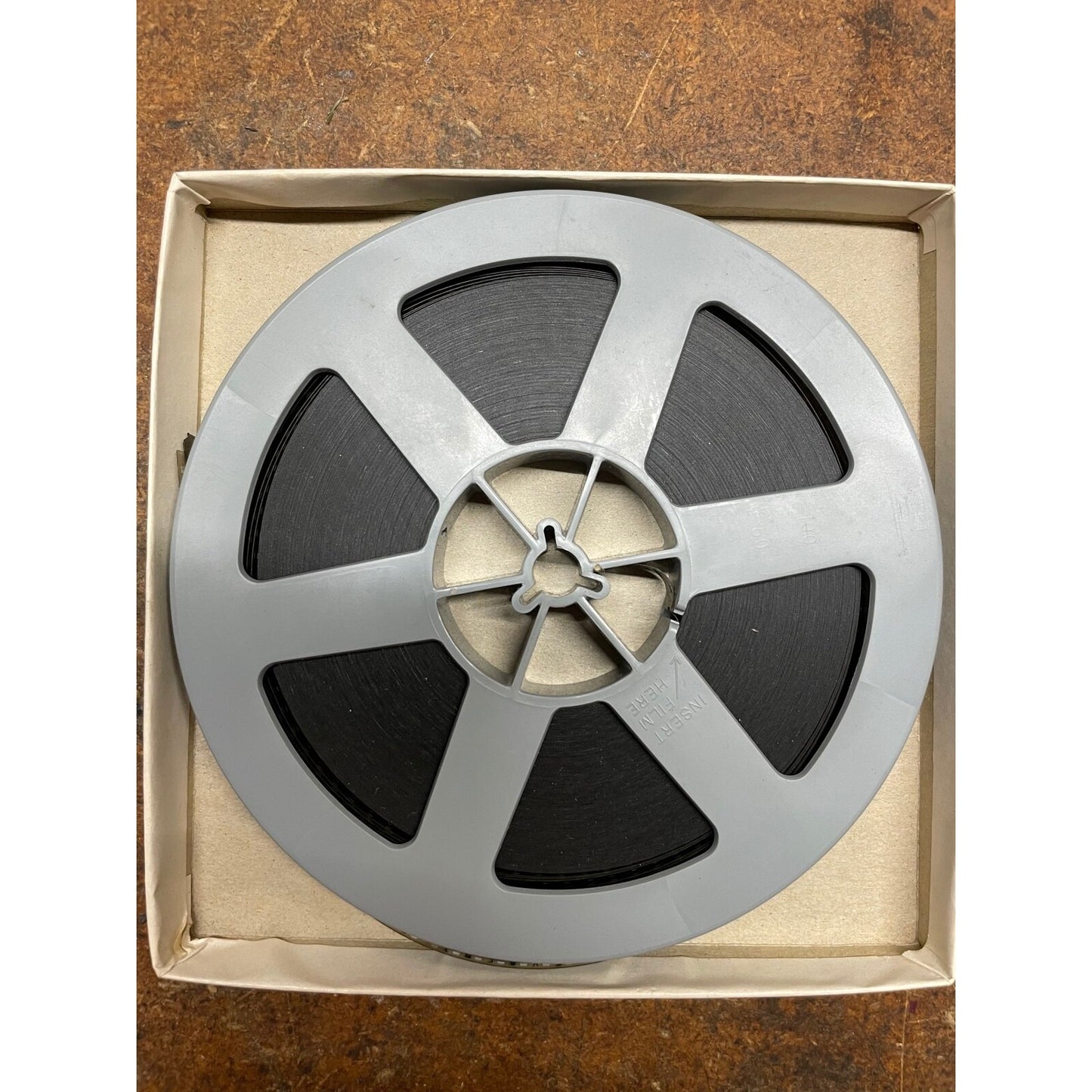 Little Roquefort Film top view of film reel in box