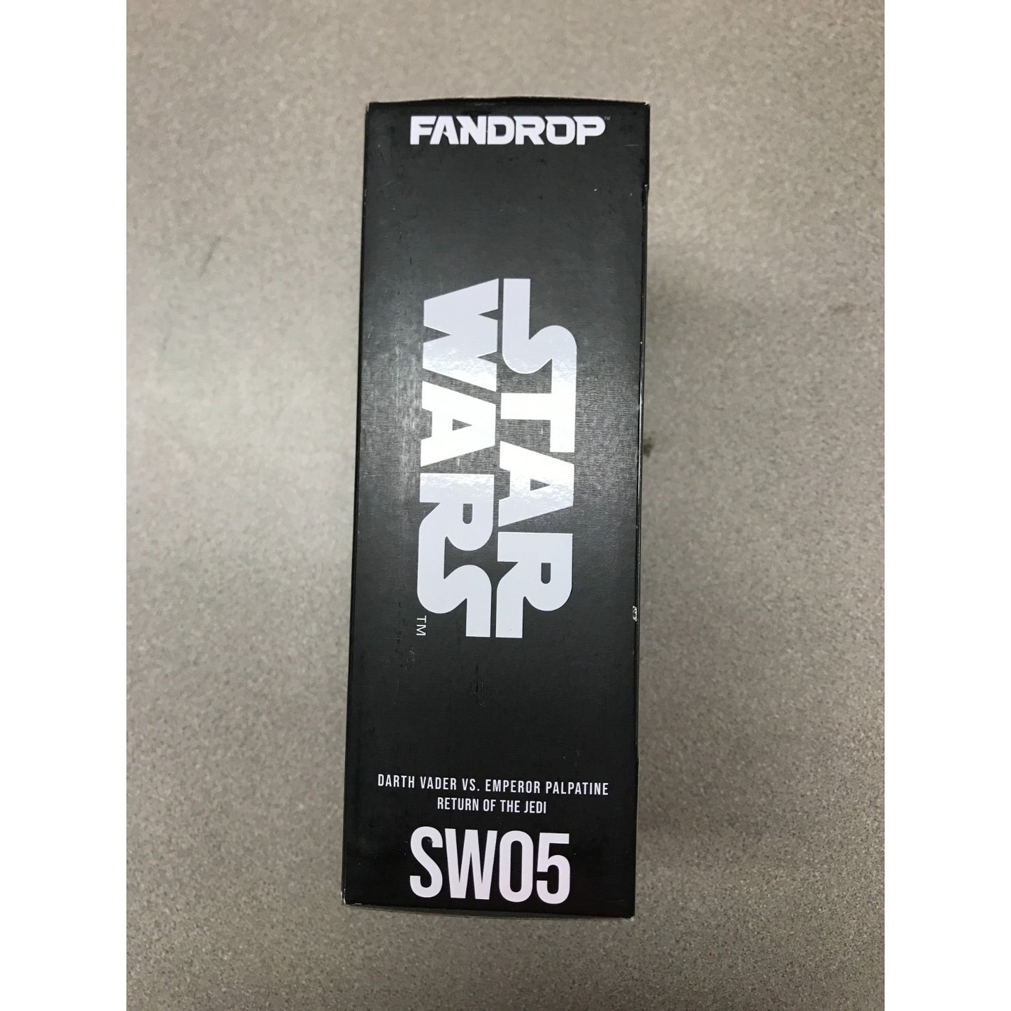A black rectangular product box for Fandrop Star Wars Return of the Jedi SW05 Earth Harbor vs. Emperor Palpatine, featuring the Star Wars logo in white on a gray surface. Top of package