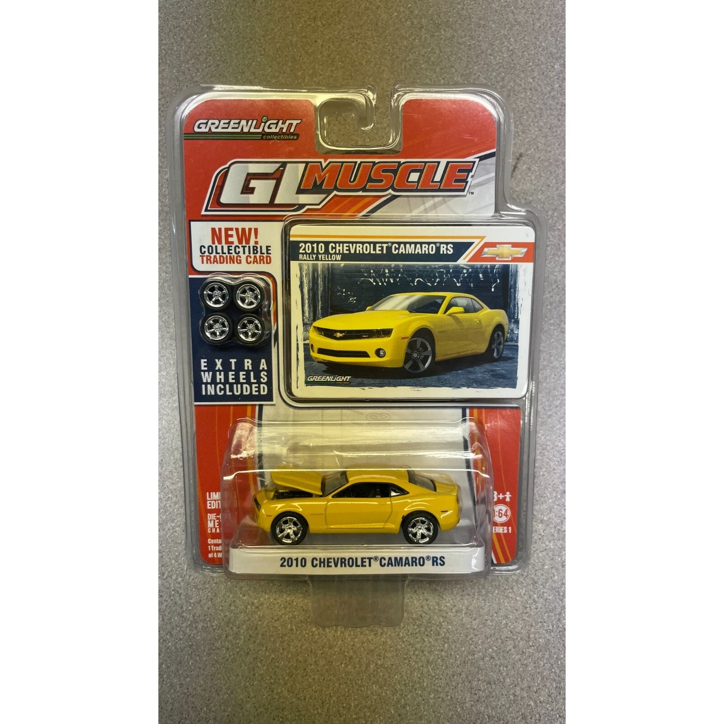 Greenlight 2010 Chevrolet Camaro Die Cast Car with Wheels and Trading Card front of package displaying car and card
