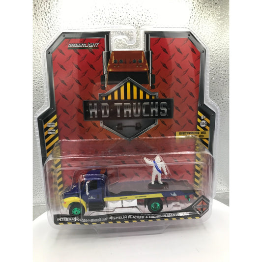 Greenlight HD Trucks Chase Michelin Flatbed &amp; Michelin Man Figure front of package displaying truck