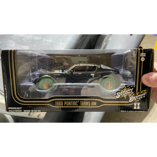 Greenlight Hollywood 1980 Pontiac Trans Am, Smokey and the Bandit II, Die-Cast Model Car 1-24 close up front of package displaying car