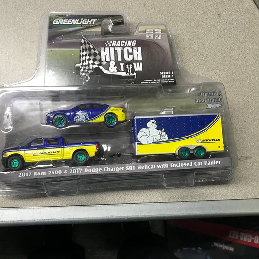 Greenlight Racing Hitch and Tow 2017 Ram 2500 &amp; Dodge Charger SRT Hellcat with Enclosed Car Hauler front of package displaying car and truck