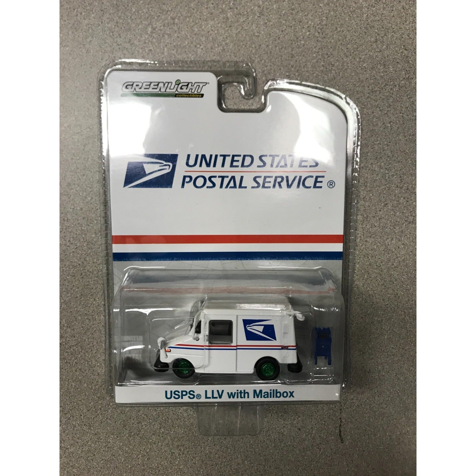 Greenlight United States Postal Service USPS LLV with Mailbox #29888 front of package displaying mail truck