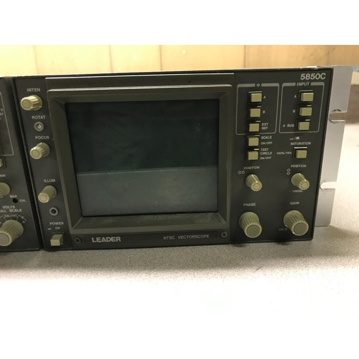 A LEADER 5850C NTC vectorscope electronic test instrument, showing its front panel with a dark screen, control knobs, and switches on a light gray surface.