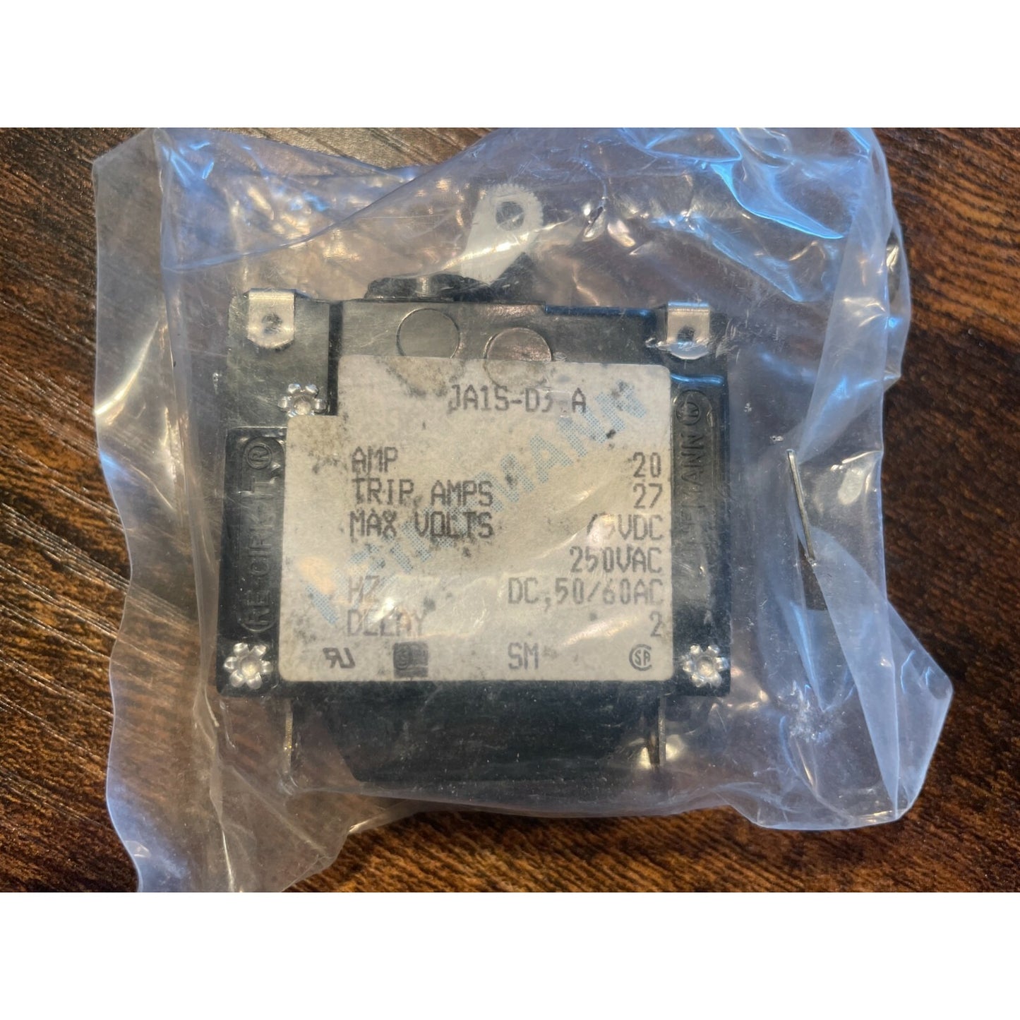 Heinemann JA1S-D3-A Breaker, 20Amp, 27TripAmps, 65VDC, 250VAC side view in package with product label