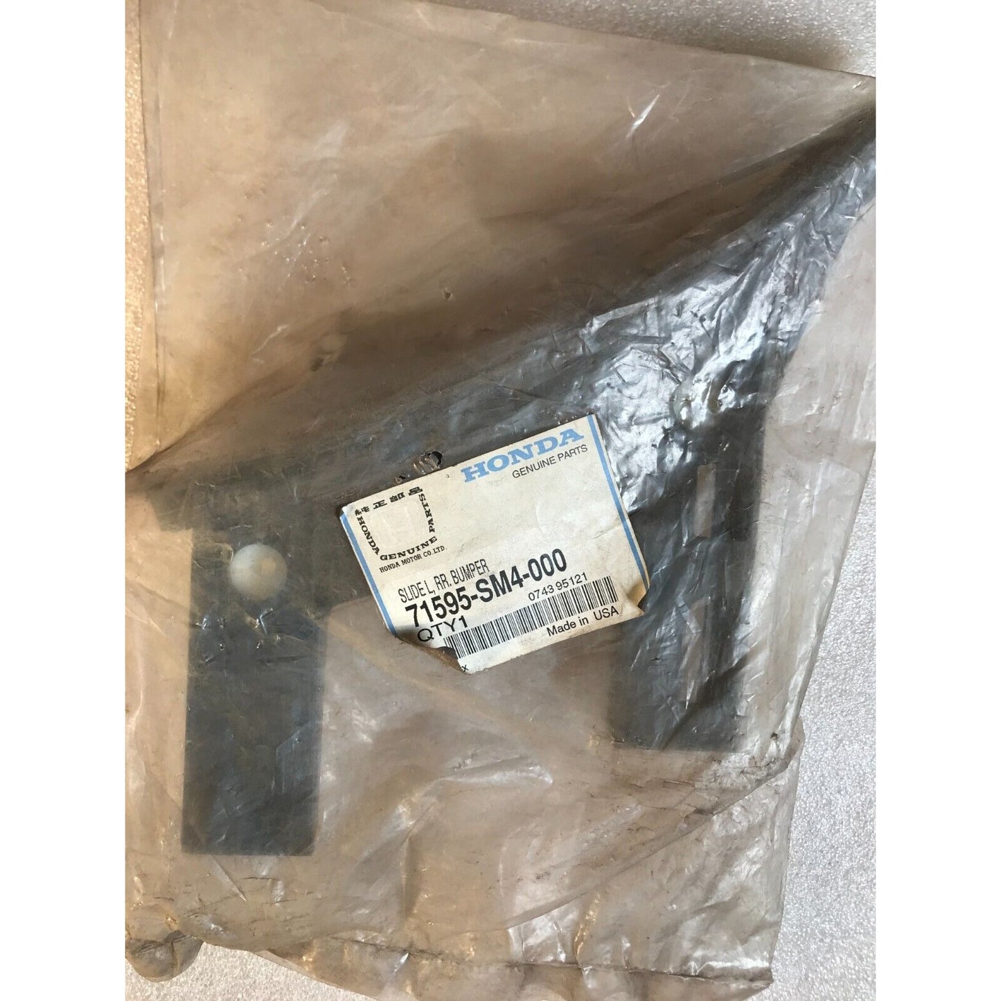 Honda 71595-SM4-000 Slide L, RR Bumper in package with product label