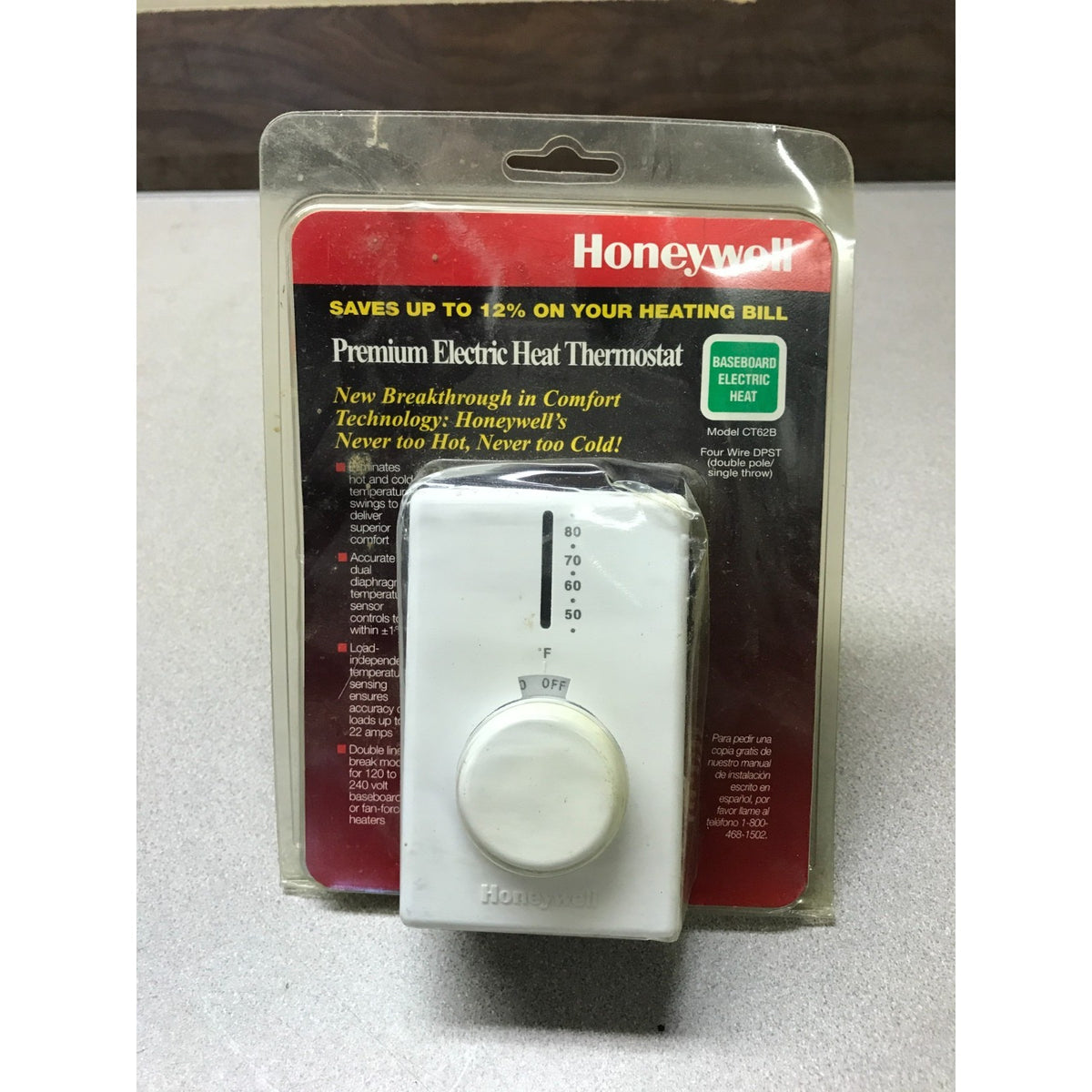 Honeywell CT62B1015 Premium Thermostat for Electric Baseboard Heaters front of unit in packaging with slight dent in plastic of top corner