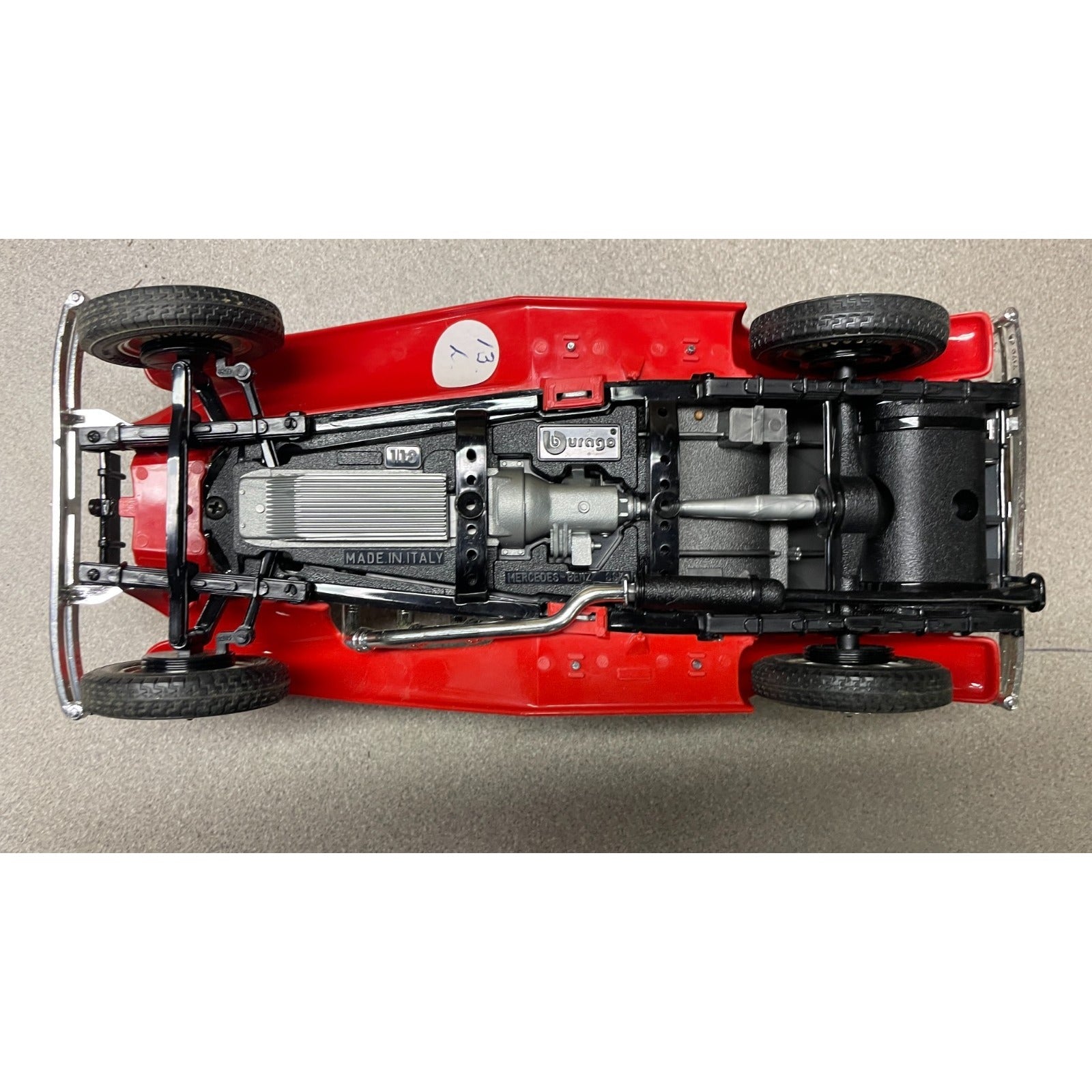 Burago 1936 Mercedes Benz 500k Roadster Red Die Cast, Scale 1:20, 3020, Made In Italy undercarriage view