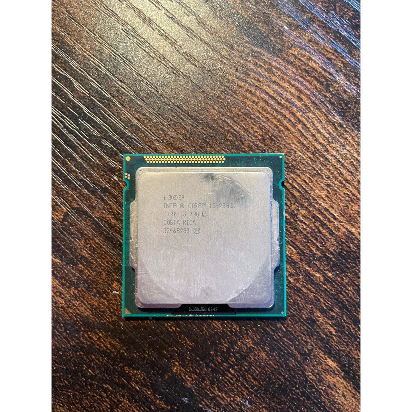 Intel Core i5-2500K 3.3GHz Quad-Core CPU Processor SR008 LGA1155 Socket bottom view with product information stamp