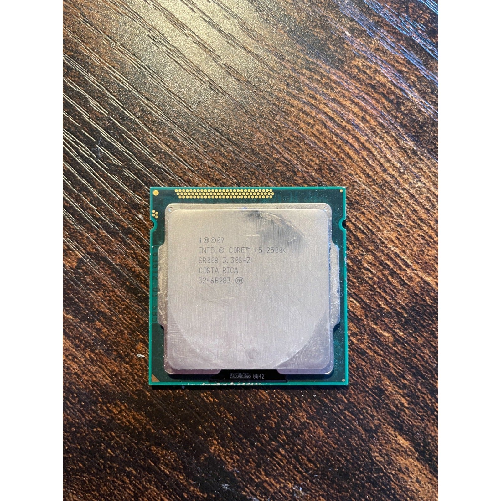 Intel Core i5-2500K 3.3GHz Quad-Core CPU Processor SR008 LGA1155 Socket bottom view with product information stamp