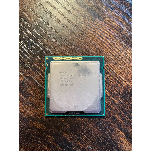 Intel Core i5-2500K 3.3GHz Quad-Core CPU Processor SR008 LGA1155 Socket bottom view with product information stamp