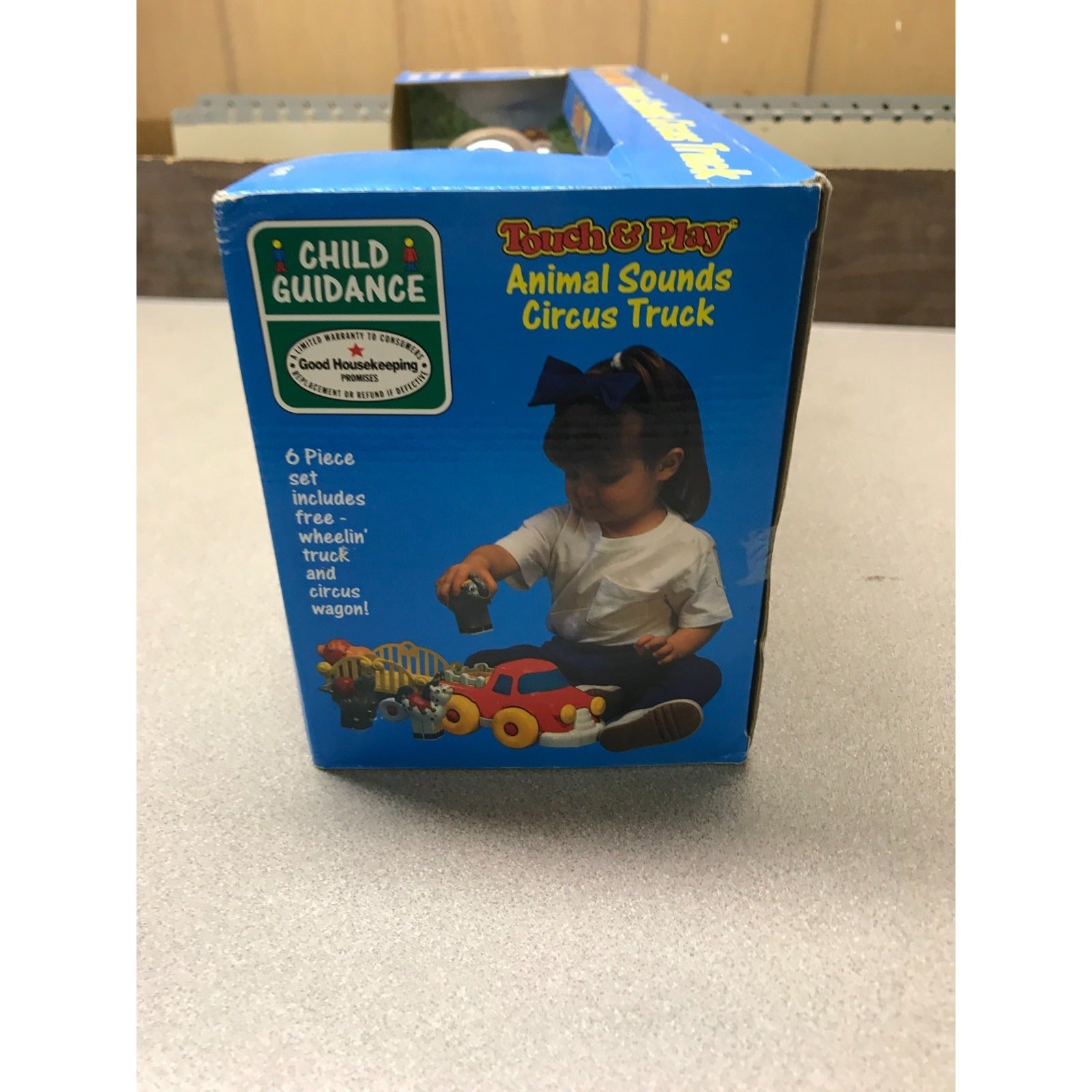 Vintage Touch and Play Animal Sounds Circus Truck side of box item details shows child playing with truck