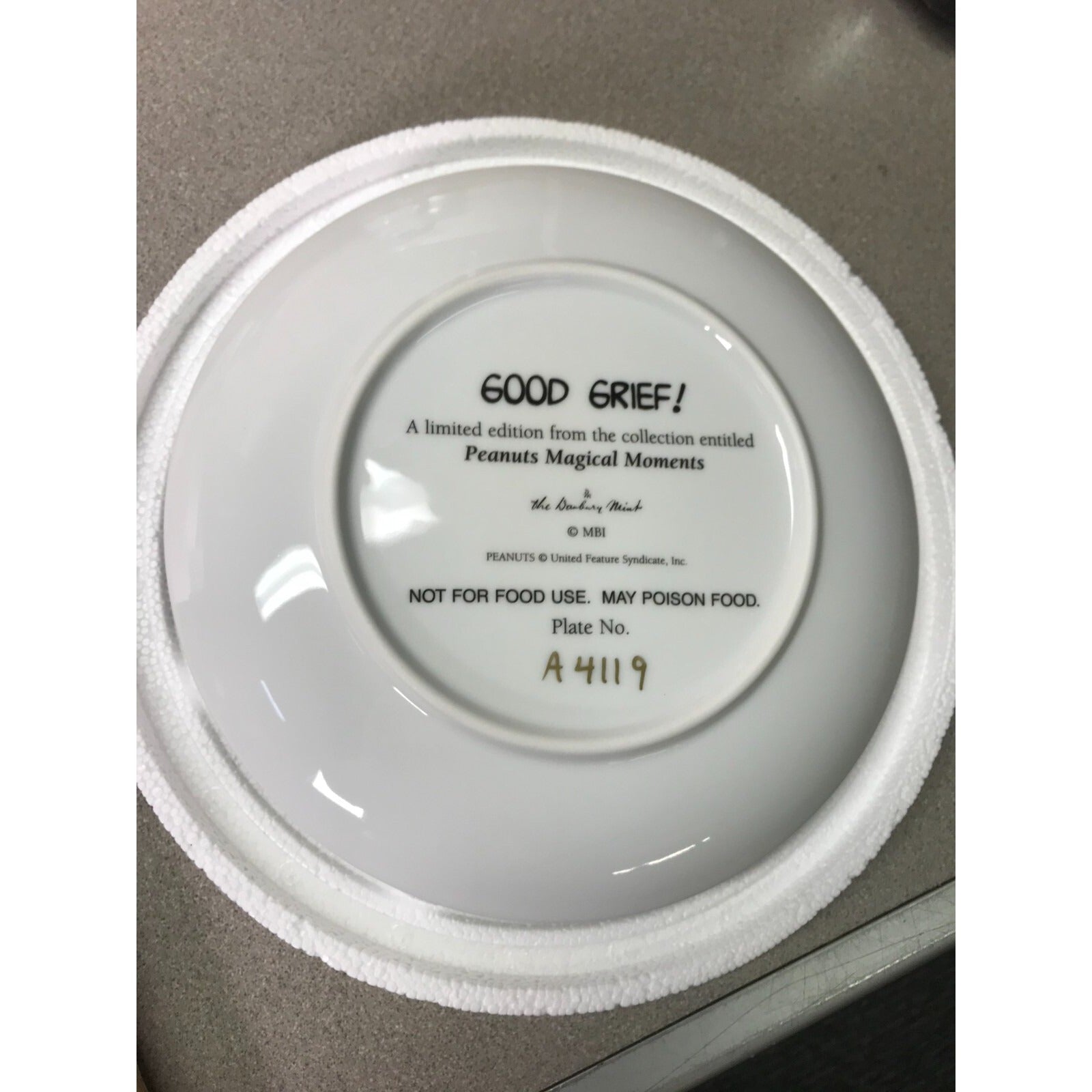 The Danbury Mint Peanuts Magical Moments Plates  "Good Grief!," "It's a Hit!" Serial No. A4119 back of plate
