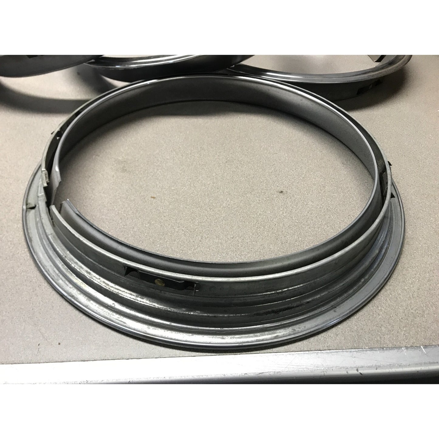 Lot 4 1966 Pontiac GTO OEM Wheel Trim Rings close up