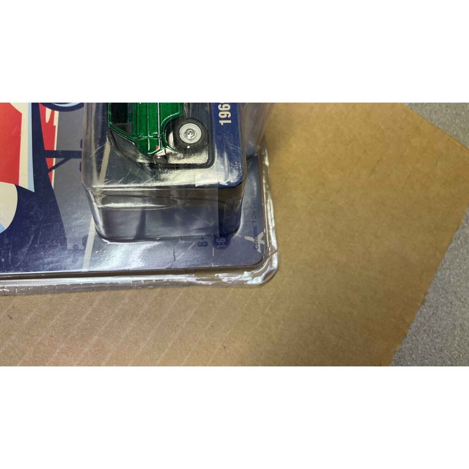 Greenlight 1969 Ford Club Wagon 1:64 corner of package closeup slight damage
