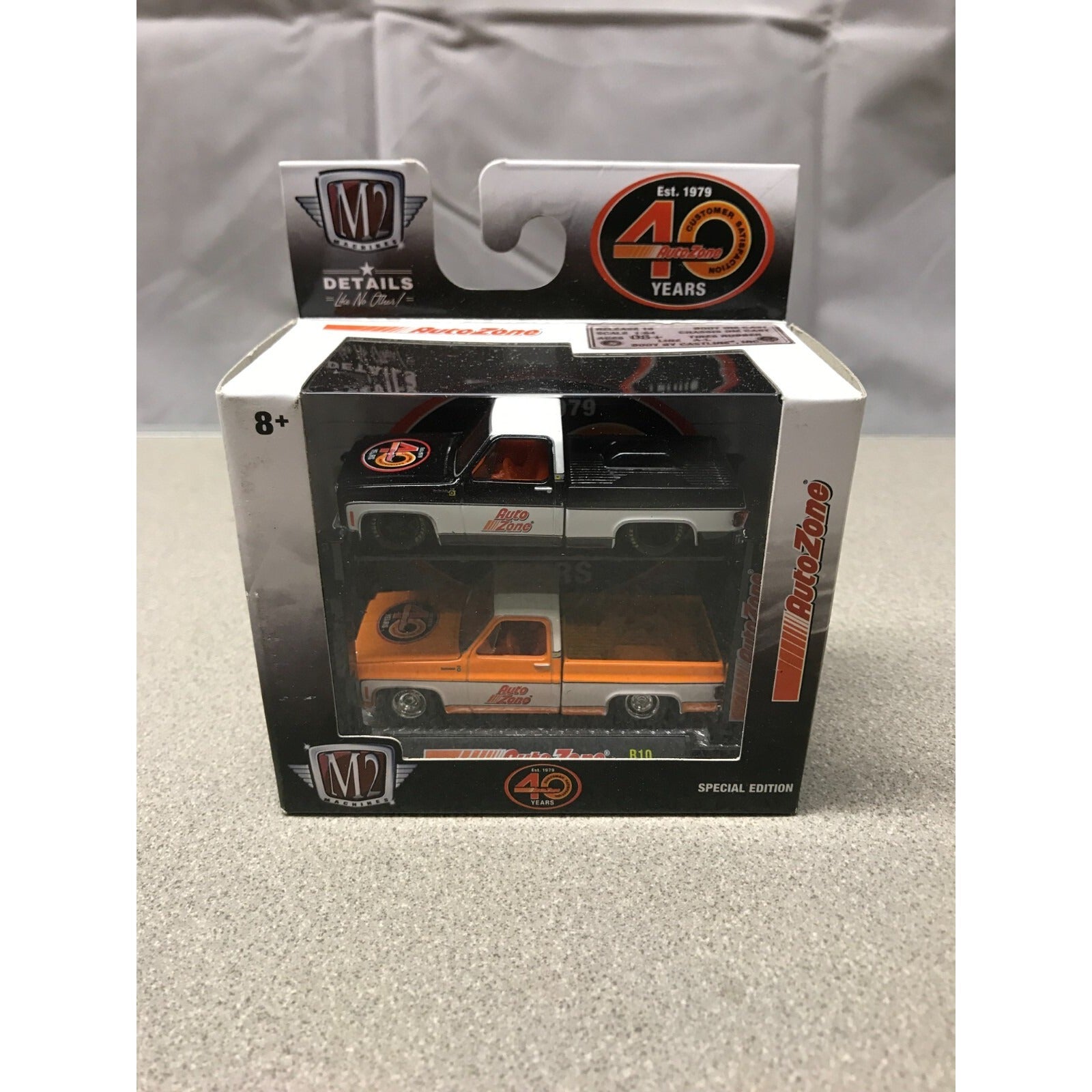 M2 AutoZone 1979 Chevrolet Scottsdale Trucks and Lift in package front view displaying trucks