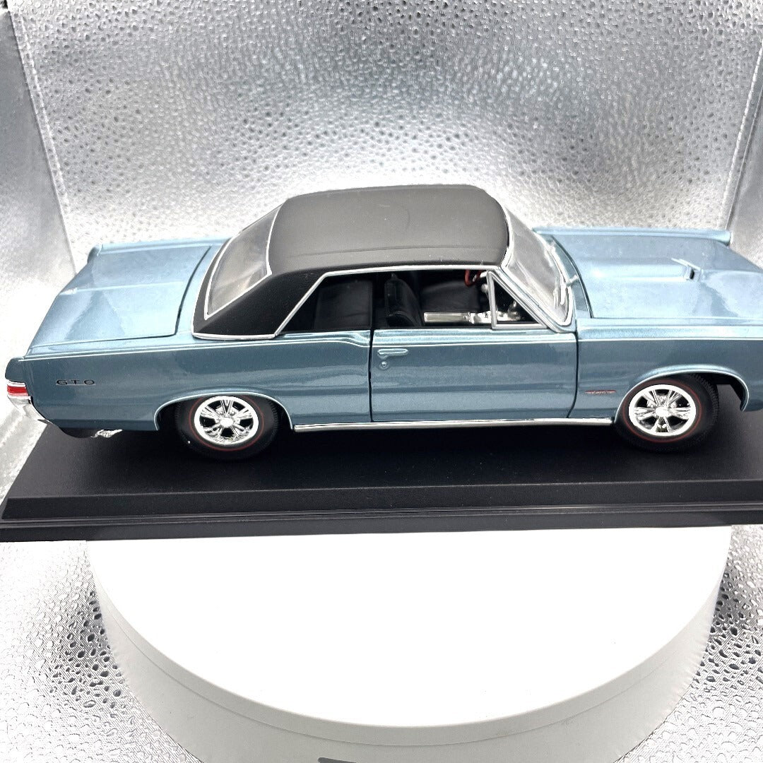 Maisto 1965 Pontiac GTO Blue Die Cast with Base, Scale: 1/18 passenger side view