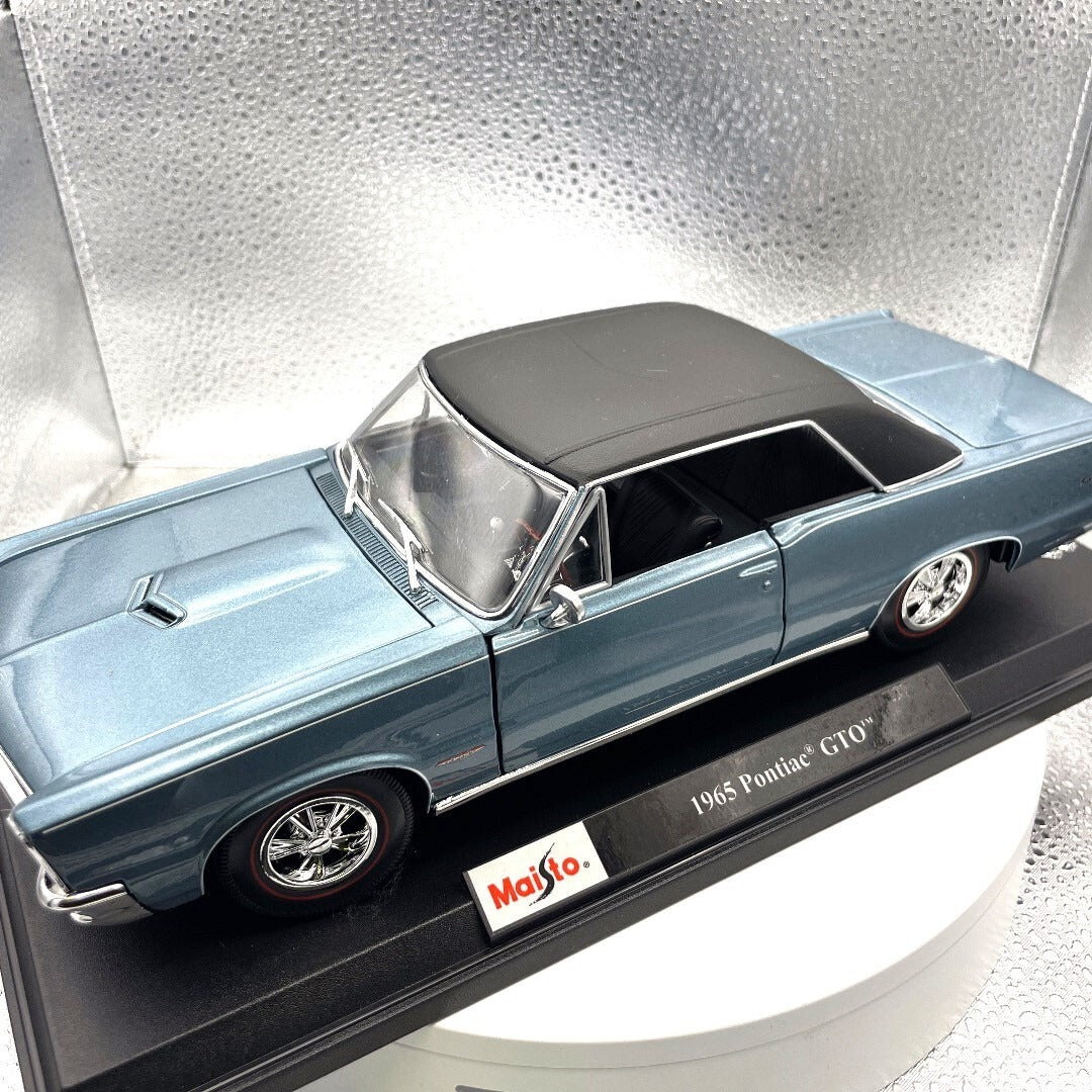 Maisto 1965 Pontiac GTO Blue Die Cast with Base, Scale: 1/18 driver's side view
