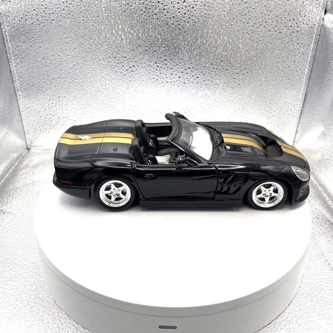 Maisto 1999 Shelby Series 1 Black and Gold Die Cast, 1/18 Scale passenger side view
