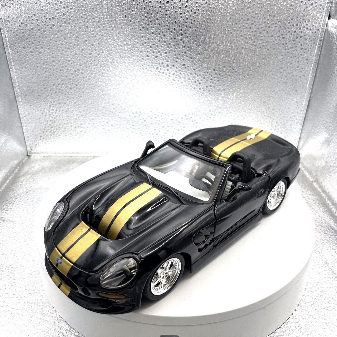 Maisto 1999 Shelby Series 1 Black and Gold Die Cast, 1/18 Scale front/driver's side view