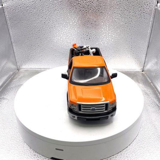 Maisto 2010 Ford F-150 STX Harley Davidson Die Cast with Motorcycle, Scale: 1/27, No. 01618 front end view